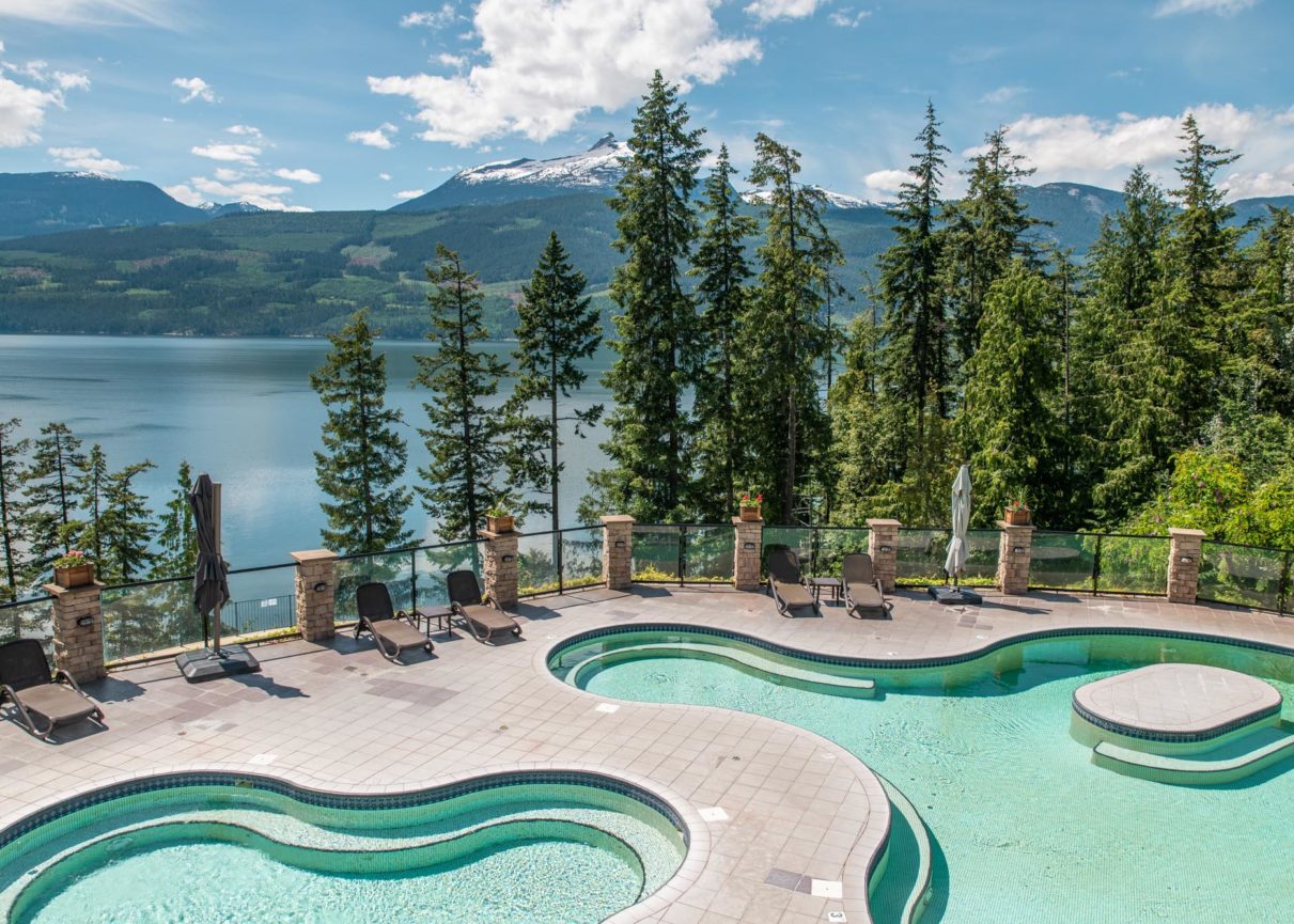 The pools at Halcyon with mountains in the background