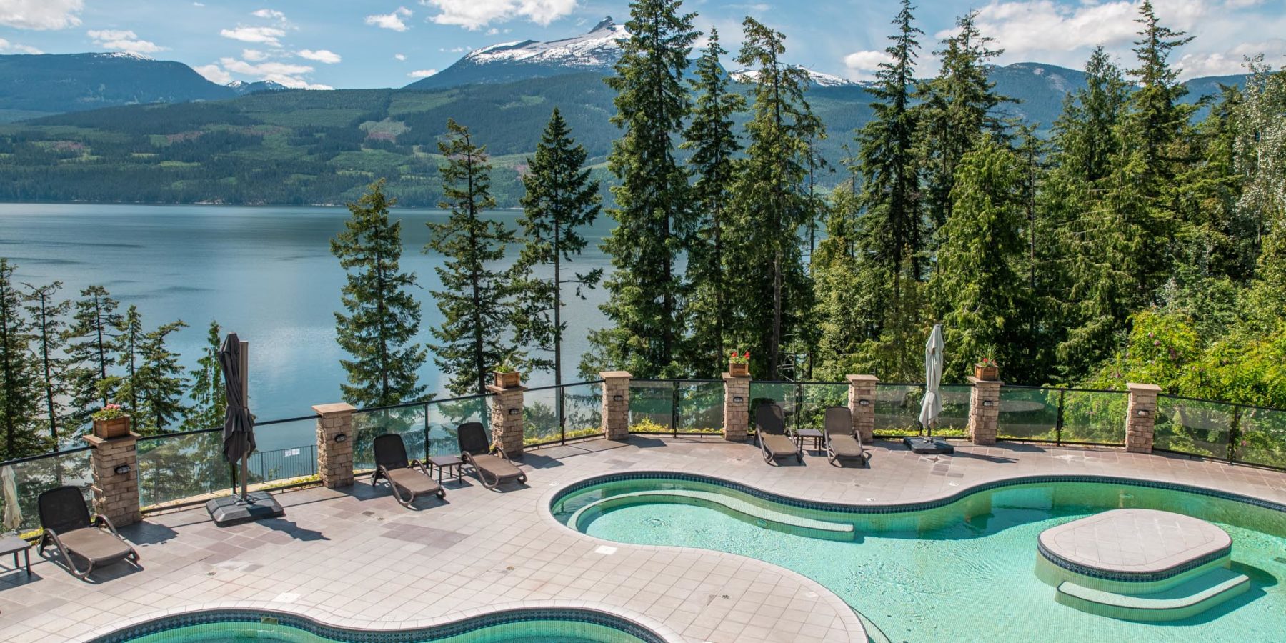 The pools at Halcyon with mountains in the background