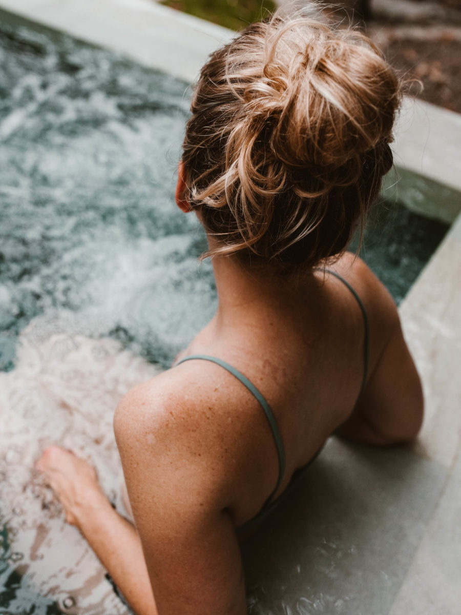 Back of women sitting in hot pool