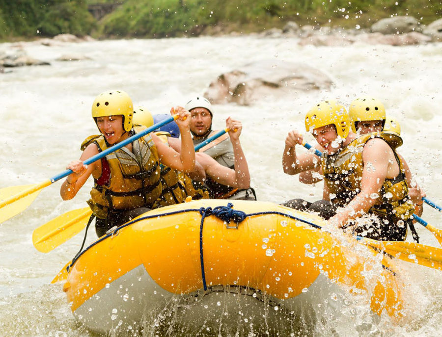 Team of People Whitewater Rafting