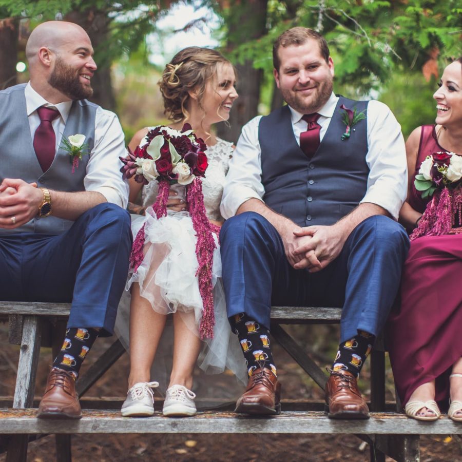 Bridesmaids and men of honour laughing
