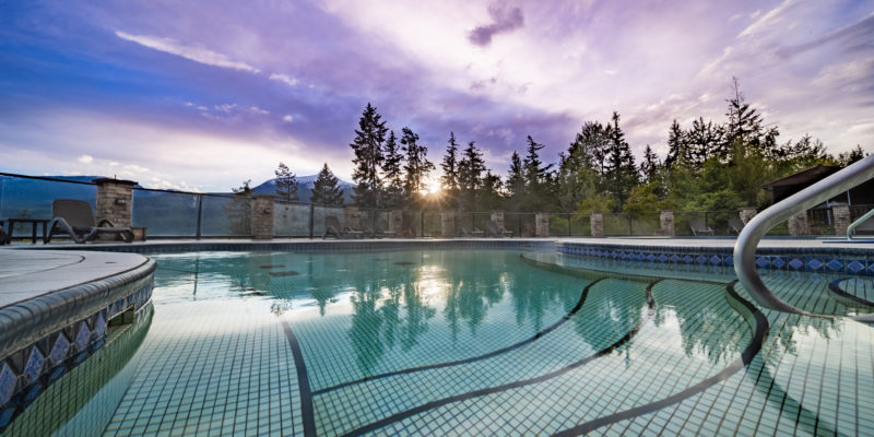 Beautiful mountain sunset over lakefront and hot springs